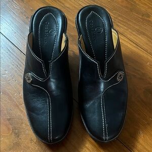 Cole Haan Black Leather Slip-On Mules with White Stitching and Logo Button